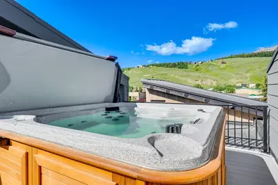 a hot tub on top of a balcony at Rooftop Mtn View and Hot Tub Silverthorne Home! in Silverthorne