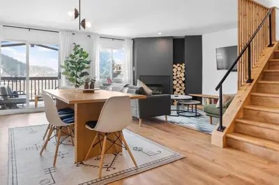 a living room with a wooden table and chairs at Stylish 2BR Near Trails and Slopes in Dillon