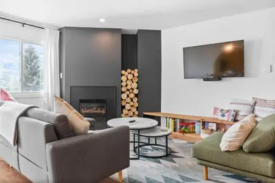 a living room with a couch and a fireplace at Stylish 2BR Near Trails and Slopes in Dillon