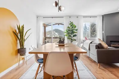 a living room with a table and a couch at Stylish 2BR Near Trails and Slopes in Dillon