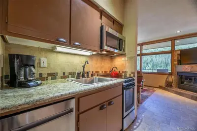 a kitchen with a sink and a stove at Keystone W Magical View Walk to Ski Lift in Keystone
