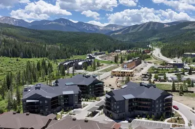 an aerial view of a resort with mountains at Ski Idlewild condo in Winter Park
