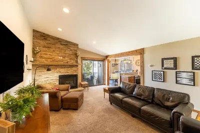 a living room with a couch and a fireplace at Lake Cliffe 303 Building E in Dillon