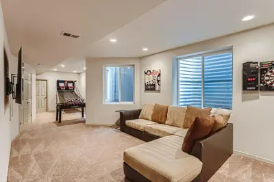 a living room with a couch and a window at 2226 N Washington St in Denver