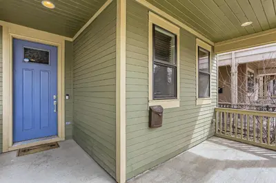 a front door of a house with a blue door at 2226 N Washington St in Denver
