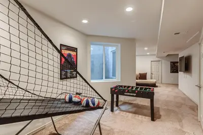 a room with a hammock and a table in it at 2226 N Washington St in Denver