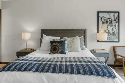 a bedroom with a large bed with pillows on it at Peaceful 5BR Retreat with Hot Tub in Breckenridge