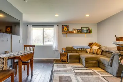 a living room with a couch and a table at 12 Mi to Denver Golden Vacation Rental! in Golden