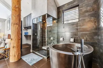 a large bathroom with a tub and a shower at Luxurious 4BR Retreat with Hot Tub Near Gold Course in Breckenridge