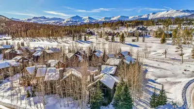 an aerial view of a home in the snow at Luxurious 4BR Retreat with Hot Tub Near Gold Course in Breckenridge