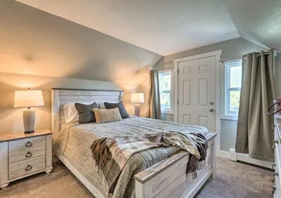 a bedroom with a large bed and a window at 4 bed 2 bath home located near Rocky Mountain National Park in Estes Park