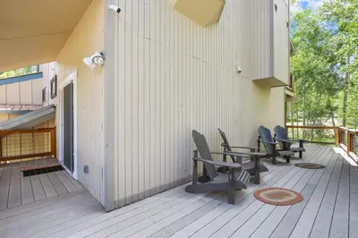 a deck with chairs and a table on a building at Stunning 3BR central to Breck Keystone Copper in Silverthorne