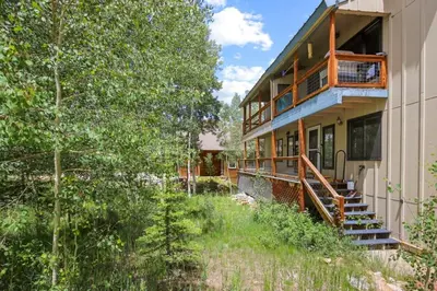 a house with a porch and a balcony on it at Stunning 3BR central to Breck Keystone Copper in Silverthorne
