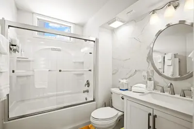 a bathroom with a shower and a toilet and a sink at Stunning 3BR central to Breck Keystone Copper in Silverthorne