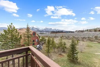 a view from the deck of a house with trees at Homey 3BR Near Lake Dillon with Mountain Views in Dillon