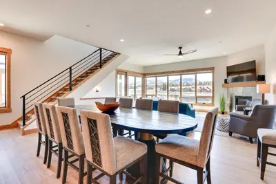 a dining room with a table and chairs at Fraser Getaway with Deck Near Winter Park Resort! in Fraser