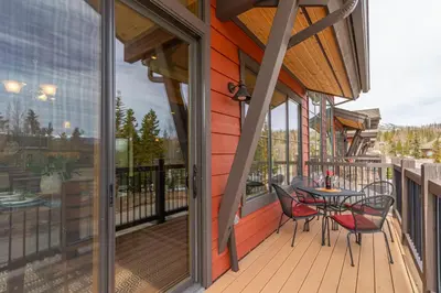 a patio with a table and chairs on a balcony at Incredible 3BR Tranquil Setting & Space to Spare in Silverthorne