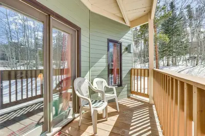 a screened porch with two chairs and windows at Convenient Winter Park, Colorado, Vacation Rental! in Winter Park