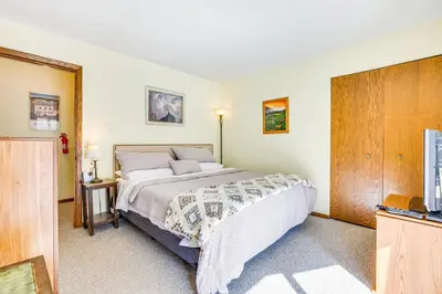 a bedroom with a large bed and a tv at Convenient Winter Park, Colorado, Vacation Rental! in Winter Park