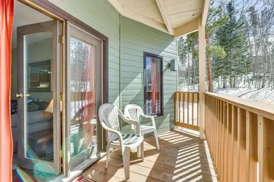 a porch of a house with two chairs on it at Convenient Winter Park, Colorado, Vacation Rental! in Winter Park