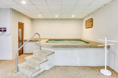 a jacuzzi tub in a room with stairs at Convenient Winter Park, Colorado, Vacation Rental! in Winter Park
