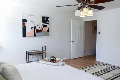 a bedroom with a bed and a ceiling fan at Change Your Altitude in Denver 3BR near Denver Airport w/GameRoom in Denver
