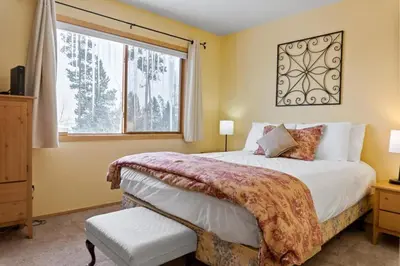 a bedroom with a large bed and a window at Cozy Frisco Condo Near Lake and Trails in Frisco