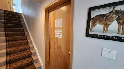 a door with a picture of a wolf on the wall at Cozy Frisco Condo Near Lake and Trails in Frisco
