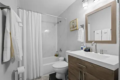 a bathroom with a sink and a toilet and a mirror at Golfers Dream! Sweet NW location. in Arvada
