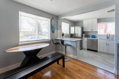 a kitchen with a table and a counter in it at Hidden Gem of Arvada! in Arvada