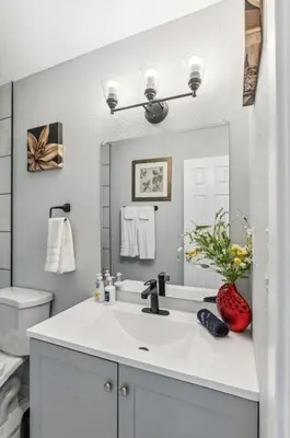 a white bathroom with a sink and a toilet at All New! Convenient Location! Sleeps 6 in Denver