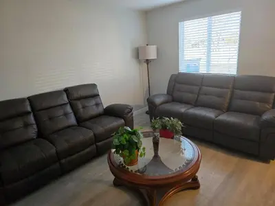 a living room with a couch and a coffee table at All New! Convenient Location! Sleeps 6 in Denver