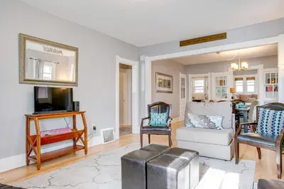a living room with a white couch and chairs at Less Than 1 Mi to Washington Park Denver Vacation Rental in Denver