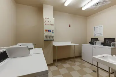 a room with two sinks and washing machines in it at 2BR Ski In Ski Out Keystone Condo Walk to Slopes in Dillon