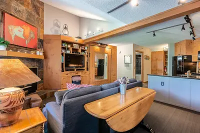 a living room with a couch and a table at Iron Horse C5013 condo in Winter Park