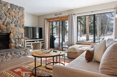 a living room with a couch and a fireplace at 2BR Keystone Condo Near Slopes in Keystone
