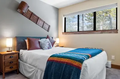 a bedroom with a large bed and a window at 2BR Keystone Condo Near Slopes in Keystone