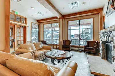 a living room with a couch and a fireplace at Buffalo Lodge 1 Bedroom In River Run in Keystone
