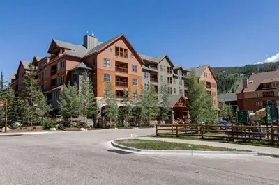a large house on the side of a street at Buffalo Lodge 1 Bedroom Condo In River Run Village in Keystone