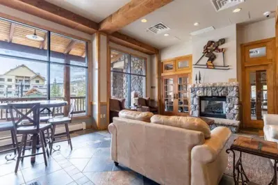 a living room with a couch and a fireplace at Buffalo Lodge 1 Bedroom Condo In River Run Village in Keystone