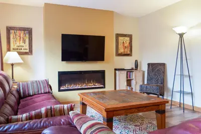 a living room with a couch and a fireplace at Cozy 2BR with Great Views Near Trails in Silverthorne