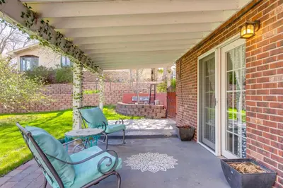 a patio with two chairs and a table at 8 Mi to Dtwn Denver Wheat Ridge Gem with Patio in Wheat Ridge