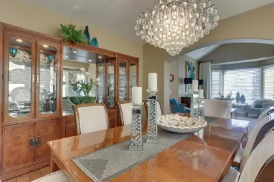 a dining room with a table and a chandelier at 1 Mi to Cherry Creek State Park Home with Game Room in Centennial