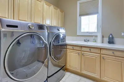 a kitchen with a washing machine in a kitchen at 1 Mi to Cherry Creek State Park Home with Game Room in Centennial