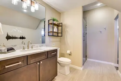 a bathroom with a toilet and a sink and a shower at 8 Mi to Keystone Home with Hot Tub in Dillon in Dillon