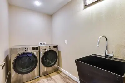 a washing machine in a laundry room with a sink at 8 Mi to Keystone Home with Hot Tub in Dillon in Dillon