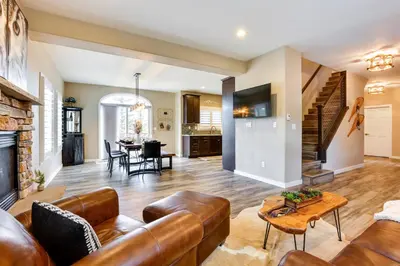 a living room with a couch and a table at 8 Mi to Keystone Home with Hot Tub in Dillon in Dillon