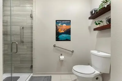a bathroom with a toilet and a shower at 1 Mi to Dtwn Cozy Retreat in Golden, CO! in Golden