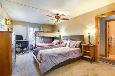 a bedroom with a bed and a ceiling fan at 1 Mi to Marina Frisco Condo with Mtn-View Balcony! in Frisco