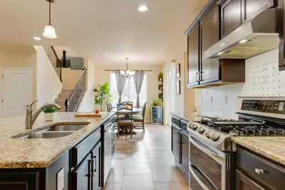a kitchen with a sink and a stove at Westminster Home with Patio and BBQ Near Dtwn Denver in Westminster